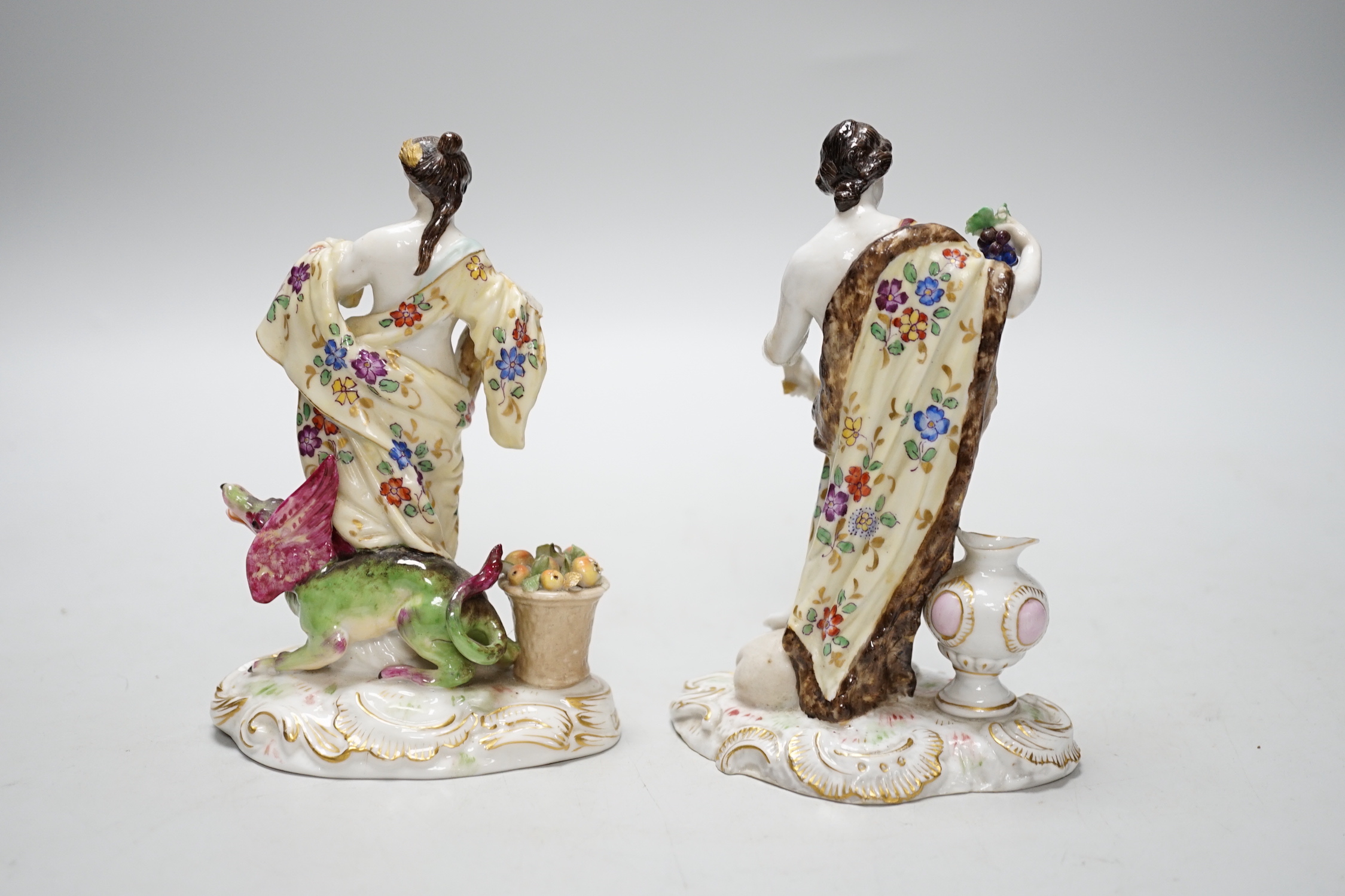 A pair of German Volkstedt porcelain figures including female with dragon, 15cm high